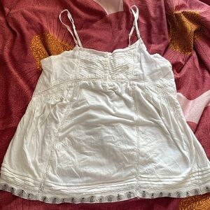 Flowy white tank top with beaded bottom